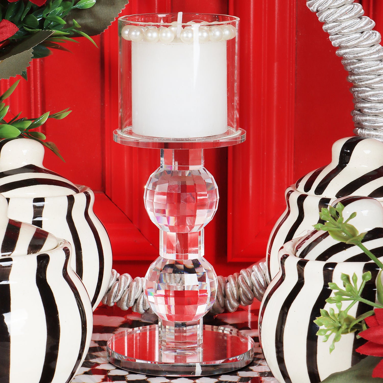 This gifting tray comes with 1 glass candle holder adorned with red flowers &amp; 4 ceramic abstract print jars filled with Oreo almonds , chocolate raisins, Pista flavored Cashew and Munchy masala cashew decorated in our MDF tray.