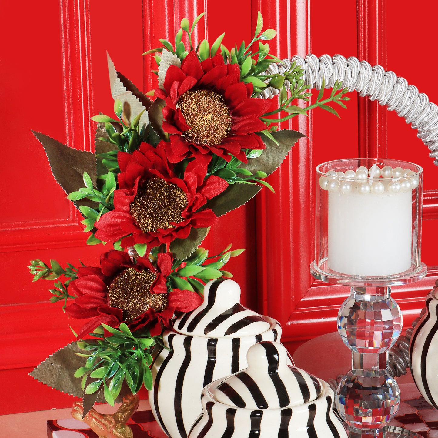 This gifting tray comes with 1 glass candle holder adorned with red flowers &amp; 4 ceramic abstract print jars filled with Oreo almonds , chocolate raisins, Pista flavored Cashew and Munchy masala cashew decorated in our MDF tray.